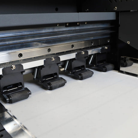 Close-up of a printing machine's film rollers with film output